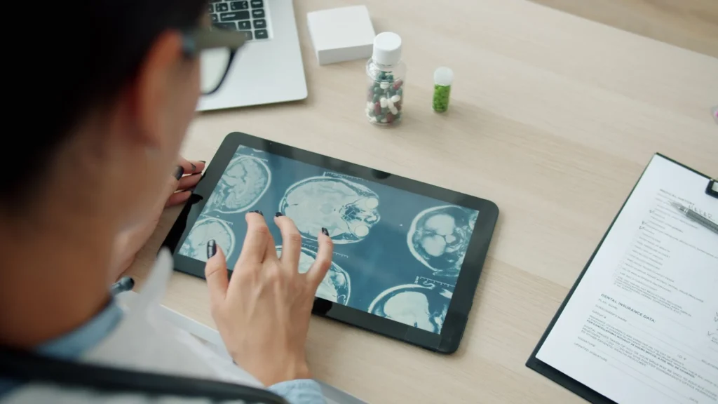 Doctor reviewing electronic health records on a tablet