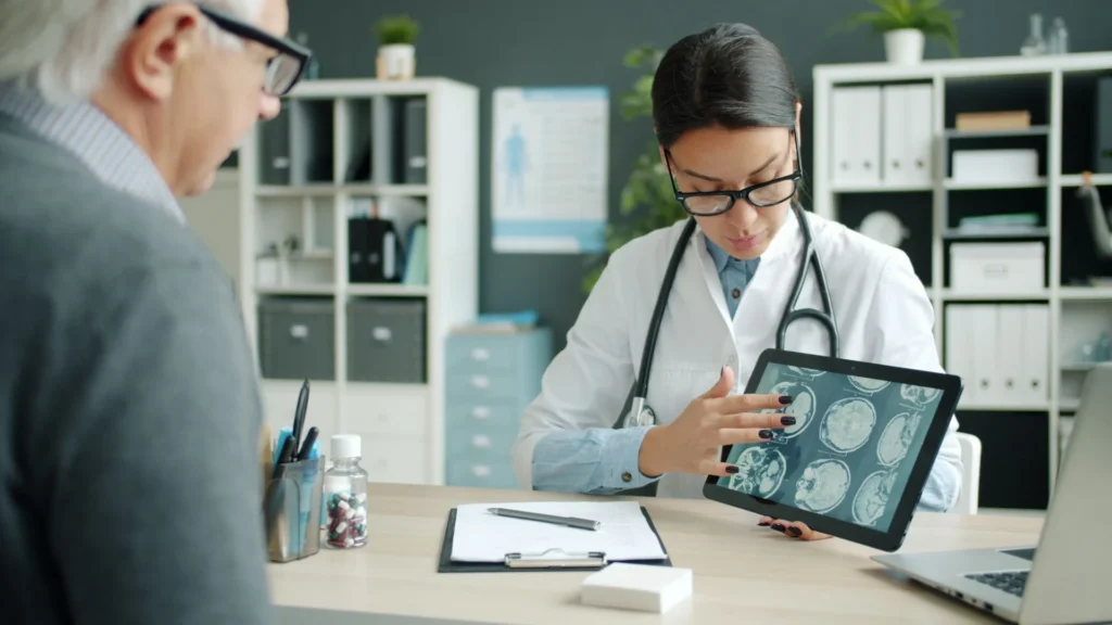 Doctor consulting a patient using a tablet
